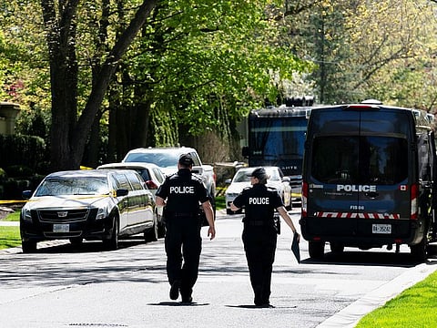 Toronto Police investigators work outside of 21 Park Lane Circle after a security guard was shot outside the Bridle Path mansion of Canadian rap star Drake in Toronto, Ontario, on May 7, 2024.