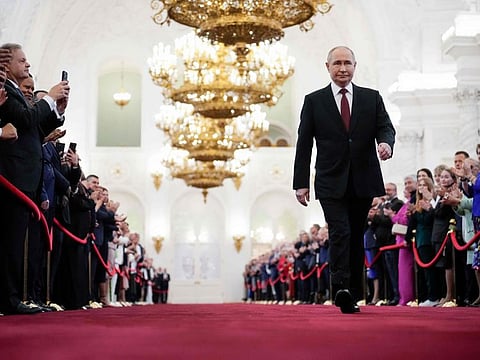 Russian president-elect Vladimir Putin walks prior to his inauguration ceremony at the Kremlin in Moscow on May 7, 2024.