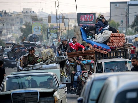 Displaced Palestinians flee Rafah with their belongings to safer areas in the southern Gaza Strip on May 7, 2024 following an evacuation order by the Israeli army the previous day, amid the ongoing conflict between Israel and the Palestinian Hamas movement.
