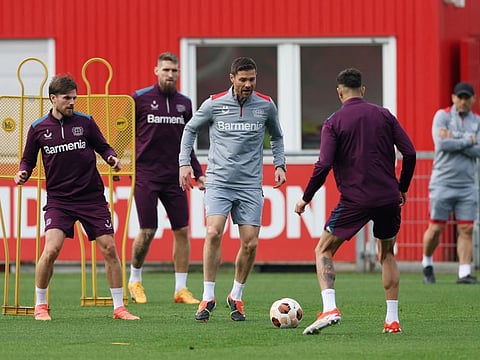 Bayer Leverkusen coach Xabi Alonso with Jonas Hofmann during training at Ulrich Haberland Stadium on Wednesday.