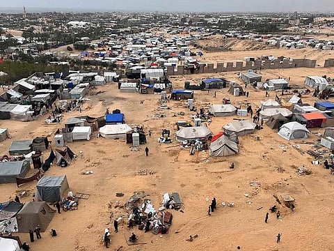 Displaced Palestinians prepare to evacuate a tent camp after Israeli forces launched a ground and air operation in the eastern part of Rafah, amid ongoing conflict between Israel and Hamas, in Rafah, in the southern Gaza Strip, May 10, 2024.