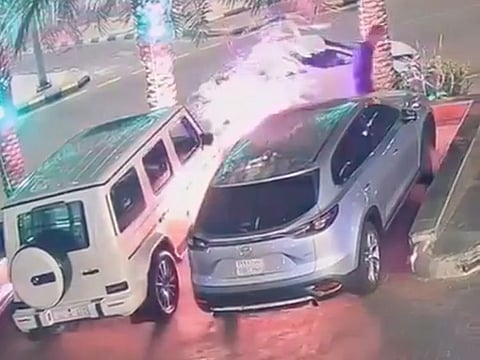 The arsonist is seen in the video filmed by a surveillance camera carrying two jericans apparently containing petrol, approaching a Mercedes and torching it before fleeing the scene.