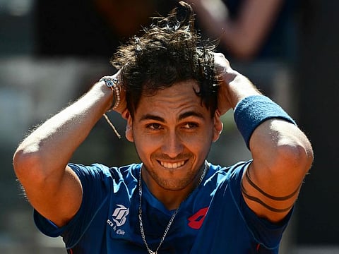 Chile's Alejandro Tabilo celebrates after winning his match against Serbia's Novak Djokovic at the Men's ATP Rome Open tennis tournament at Foro Italico in Rome on Sunday.