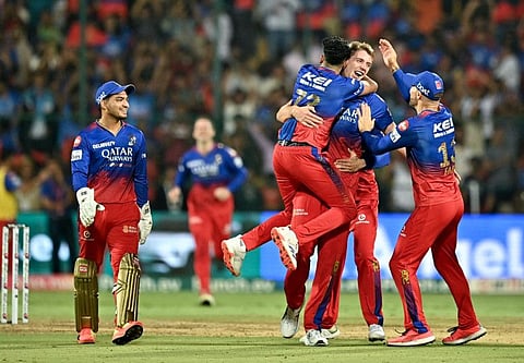 Royal Challengers Bengaluru's Cameron Green celebrates with teammates after taking the wicket of Delhi Capitals' Tristan Stubbs during the Indian Premier League (IPL) match at the M Chinnaswamy Stadium in Bengaluru on Sunday.