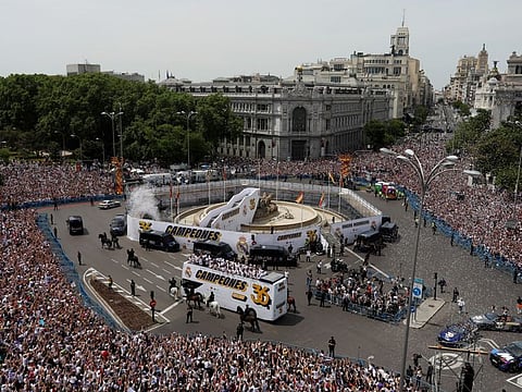 General view as Real Madrid parade bus arrives at the Cibeles Fountain during the celebration.