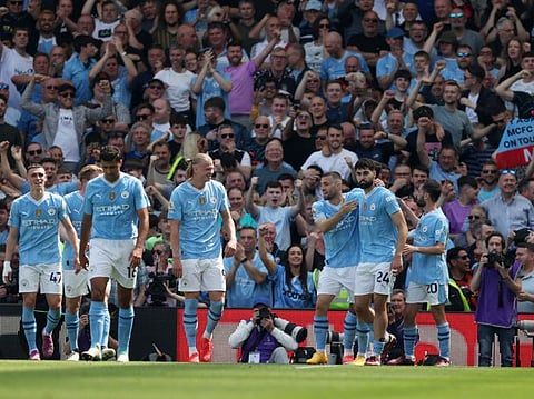 Manchester City's Josko Gvardiol celebrates scoring their third goal with teammates during a Premier League match against Fulham.
