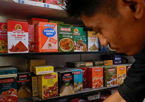 Spice boxes of MDH and Everest kept on the shelf of a shop at a market in New Delhi.