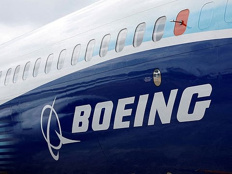 The Boeing logo is seen on the side of a Boeing 737 MAX.