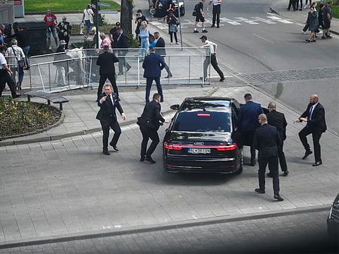 Security officers move Slovak PM Robert Fico in a car after a shooting incident, after a Slovak government meeting in Handlova, Slovakia, May 15, 2024.