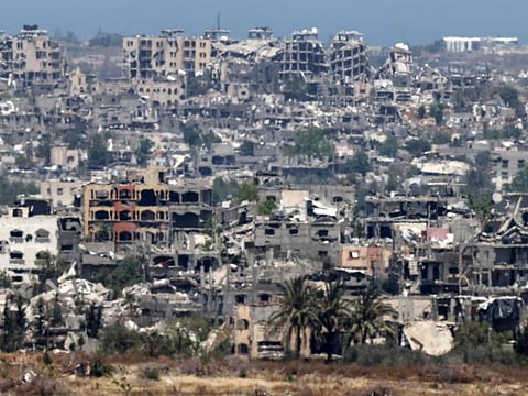 This picture taken from Israel's southern border with the Gaza Strip shows destroyed buildings in the Palestinian territory on May 15, 2024.