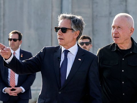 US Secretary of State Antony Blinken gestures as he walks with Israeli Defence Minister Yoav Gallant at the Kerem Shalom border crossing with the Gaza Strip in southern Israel on May 1, 2024.
