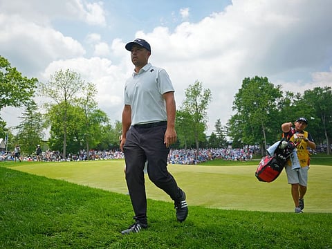 Xander Schauffele walks off the eighth hole during the first round of the PGA Championship golf tournament at Valhalla Golf Club.