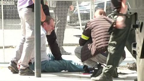 This image taken from video footage obtained by AFPTV shows security personnel apprehending a suspected gunman (left) after Slovakia's Prime Minister was shot in Handlova on May 15, 2024.