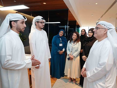 Dr. Abdulrahman Al Awar, UAE Minister of Human Resources and Emiratisation (MoHRE), talk to Emiratis working at AW Rostamani Group, during which he applauding their dedication and excellence at the company. Dr Al Awar was joined by other ministry officials during the visit.