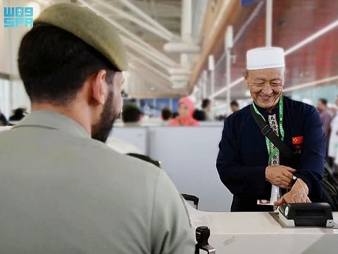 Hajj pilgrims arriving from China land in Medina.