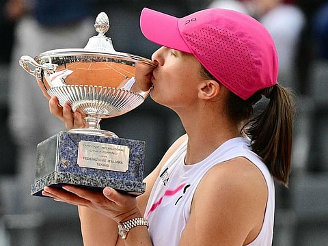 Poland's Iga Swiatek poses with her trophy after winning the Women's final against Belarus' Aryna Sabalenka at the WTA Rome Open tennis tournament at Foro Italico in Rome on May 18, 2024.