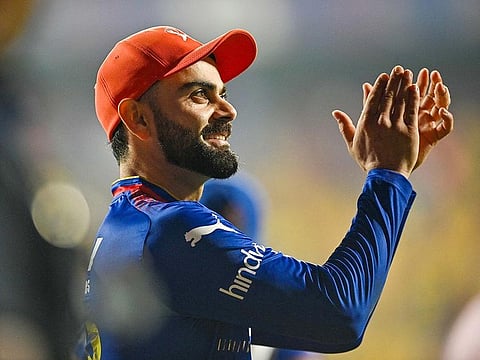 Royal Challengers Bengaluru's Virat Kohli celebrates after winning the Indian Premier League (IPL) Twenty20 cricket match against Chennai Super Kings at the M Chinnaswamy Stadium in Bengaluru on May 18, 2024.