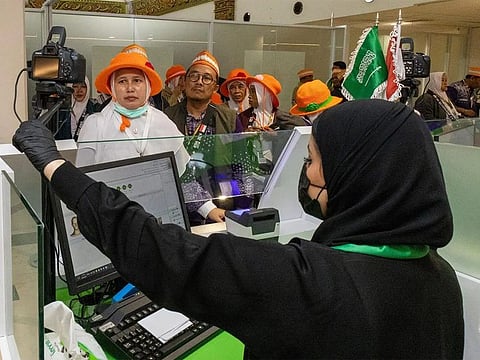 Hajj pilgrims covered by the “Mecca Road” initiative at Indonesia’s Juanda airport.