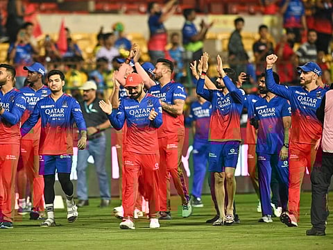 Royal Challengers Bengaluru's players celebrate after winning the Indian Premier League (IPL) Twenty20 cricket match against Chennai Super Kings at the M Chinnaswamy Stadium in Bengaluru on Saturday.