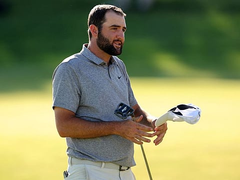 Scottie Scheffler of the United States looks on from the 18th green during the third round of the 2024 PGA Championship at Valhalla Golf Club on Saturday..