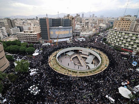 Iranians gather at Valiasr Square in central Tehran to mourn the death of President Ebrahim Raisi and Foreign Minister Hossein Amir-Abdollahian in a helicopter crash the previous day, on May 20, 2024.