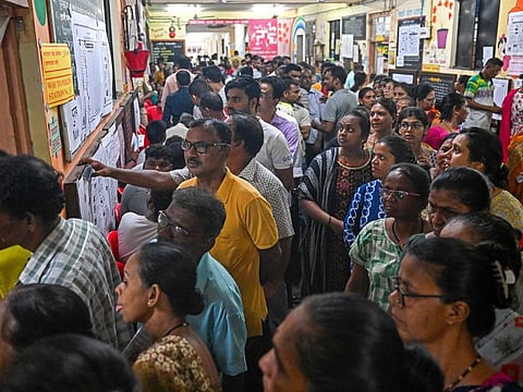 Voters queue up to cast their ballots at a polling station during the fifth phase of voting in Indias general election, in Mumbai on May 20, 2024.