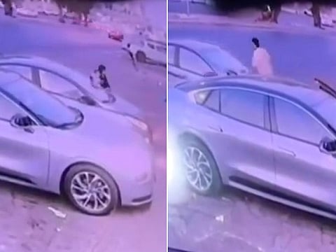 Caught on surveillance footage, the dramatic scene unfolded when a mother, who had left her car engine running, momentarily stepped out with an infant, heading towards a shop.