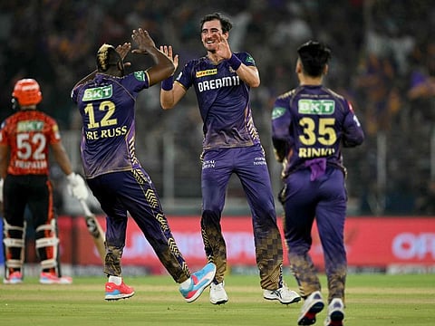 Kolkata Knight Riders' Mitchell Starc celebrates with teammates after taking the wicket of Sunrisers Hyderabad's Shahbaz Ahmed during the Indian Premier League (IPL) Twenty20 first qualifier cricket match at the Narendra Modi Stadium in Ahmedabad on Tuesday.