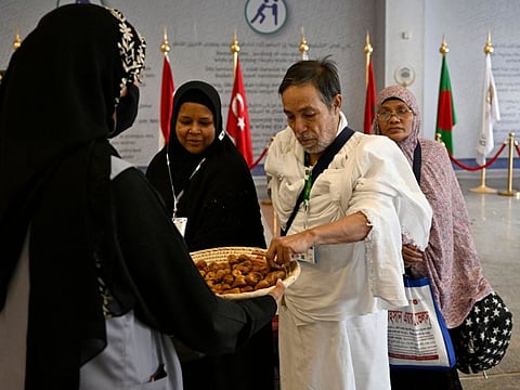 Pilgrims are greeted upon their arrival at King Abdul Aziz International Airport in Jeddah, ahead of the Hajj pilgrimage in Mecca.