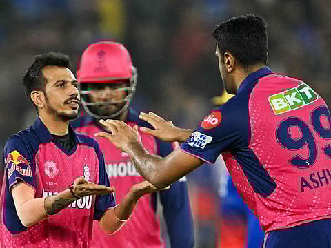 Rajasthan Royals' Ravichandran Ashwin (right) celebrates with Yuzvendra Chahal during the Indian Premier League eliminator cricket match in Ahmedabad on May 22, 2024. Ashwin and Chahal could play a decisive role in the second qualifier at Chennai on Sunday.