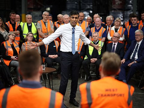 Britain's Prime Minister and Conservative Party leader Rishi Sunak holds a Q&A with staff of a West William distribution centre in Ilkeston in the East Midlands on May 23, 2024 as part of a campaign event ahead of a general election on July 4.