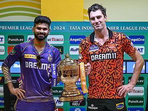 Kolkata Knight Riders’ captain Shreyas Iyer (left) and Sunrisers Hyderabad’s skipper Pat Cummins pose with the Indian Premier League trophy during a press conference at the MA Chidambaram Stadium in Chennai on May 25, 2024. The teams clash in Sunday’s final.