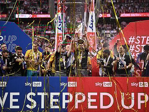 Southampton's Jack Stephens lifts the trophy with teammates after winning the Championship Play-Off final against Leeds United at Wembley Stadium, London, on Sunday.