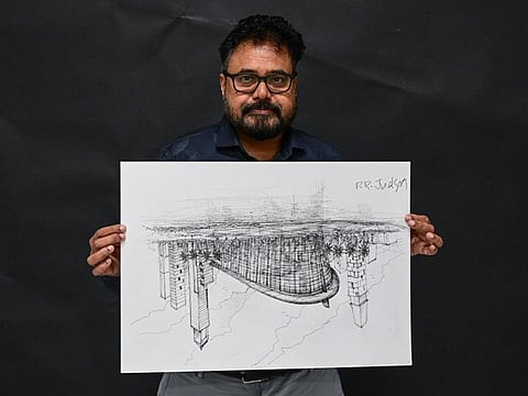 PR Judson with a detailed sketch of Dubai Opera, which he drew upside-down from memory in just 1.5 hours during a live demo at Gulf News in Dubai