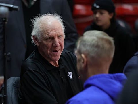 Bill Walton speaks with Brigham Young Cougars athletic director Tom Holmoe before the game between the Utah Utes and the Brigham Young Cougars at Jon M. Huntsman Cente