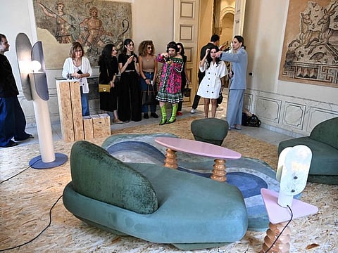 Visitors look at furniture designed in Lebanon during the annual event 'We Design Beirut' at Villa Audi, one of several venues in Beirut which welcomed the large-scale exhibition that celebrates Lebanese innovation in the field of design, blending national heritage and modernity, on May 23, 2024.
