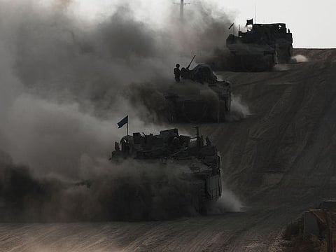 Israeli armoured personnel carriers (APC) operate, amid the ongoing conflict between Israel and the Palestinian Islamist group Hamas.