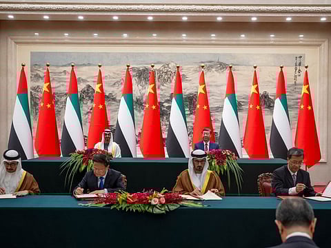 Beijin: Sheikh Mohamed bin Zayed Al Nahyan, President of the United Arab Emirates (back L) and Xi Jinping, President of China (back R), witness the signing of a Memorandum of Understanding (MOU) ceremony, during a state visit reception, at the Great Hall of the People. Seen signing on behalf of the UAE Sheikh Abdullah bin Zayed Al Nahyan (front L) and Hussain Ibrahim Al Hammadi (front 3rd L).