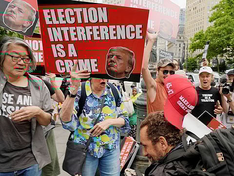 A Trump supporter clashes with anti-Trump demonstrators outside the Manhattan criminal court following the announcement of Republican presidential candidate Donald Trump's verdict in his criminal trial over charges that he falsified business records to conceal money paid to silence porn star Stormy Daniels in 2016, in New York City, on May 30, 2024.