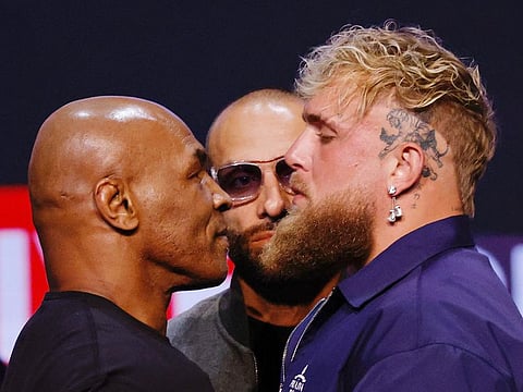Mike Tyson and Jake Paul face off during a press conference at the Apollo Theatre in New York, on May 13, 2024.