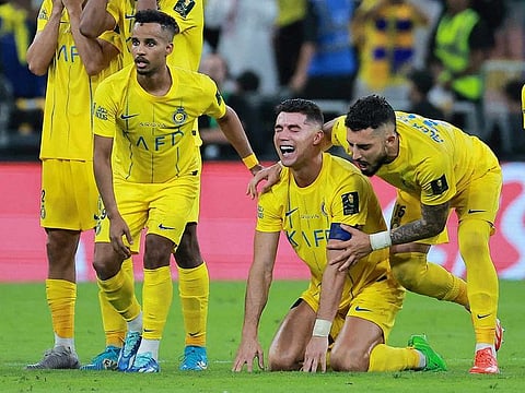 Al Nassr's Cristiano Ronaldo in tears, seen with Alex Telles and Abdulrahman Ghareeb after losing the penalty shootout at the Saudi King Cup final.