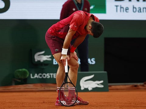 Serbia's Novak Djokovic reacts during his third round match against Italy's Lorenzo late Saturday night.