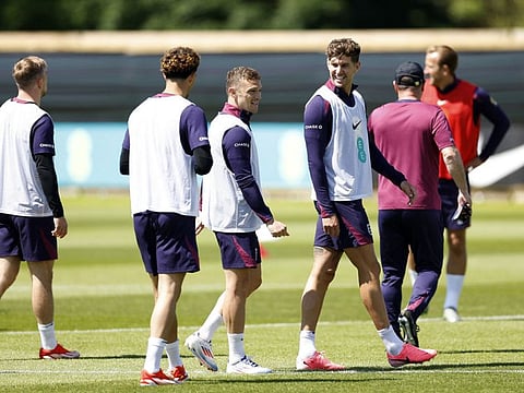 England's John Stones with Kieran Trippier and teammates during training at Rockliffe Park, Middlesbrough, Britain on Sunday.