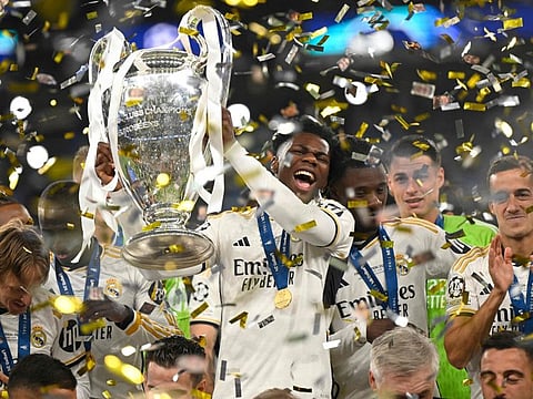Real Madrid's French defender Aurelien Tchouameni lifts the trophy to celebrate the victory at the end of the Uefa Champions League final football match against Borussia Dortmund at Wembley stadium, in London, on Saturday.