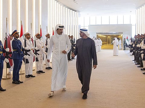 President His Highness Sheikh Mohamed bin Zayed Al Nahyan (R) and Emir of Qatar Sheikh Tamim bin Hamad Al Thani upon his arrival at the Presidential Flight in Abu Dhabi on Sunday