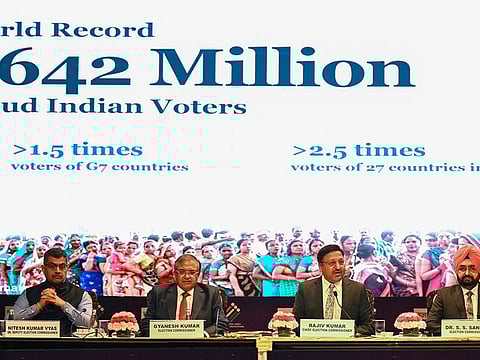 Chief Election Commissioner of India, Rajiv Kumar (2R) with Election commissioners, Gyanesh Kumar (2L) and S.S. Sandhu (R) address a news conference in New Delhi.