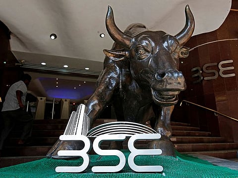 Investors await clear signals from next Indian government as Sensex and rupee see drops on election results.