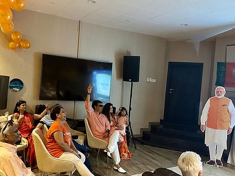 Expats gathered at a villa in Al Barsha to watch the live coverage of the poll results