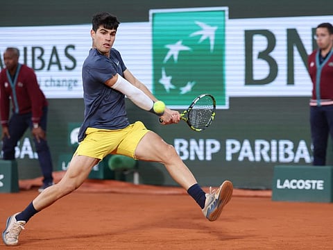 Spain's Carlos Alcaraz Garfia in action against Greece's Stefanos Tsitsipas during their men's singles quarter final match on Court Philippe-Chatrier at the Roland Garros Complex in Paris on Tuesday.
