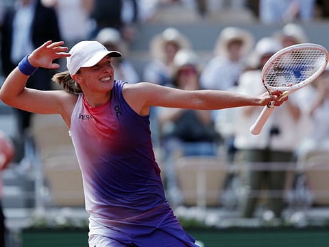 Poland's Iga Swiatek celebrates winning her semi-final match against Coco Gauff of the US at Roland Garros, Paris, on Thursday.